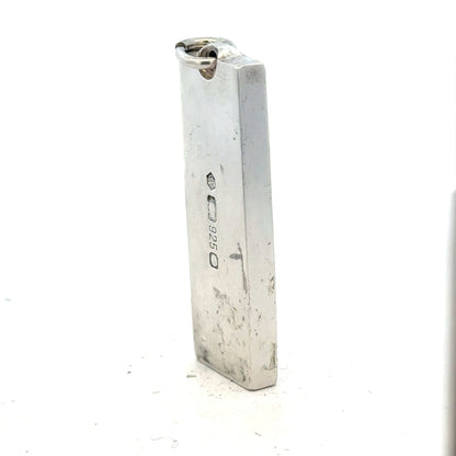 Silver ingot pendant weighing 31g, unbranded, with a sleek rectangular design and polished finish.