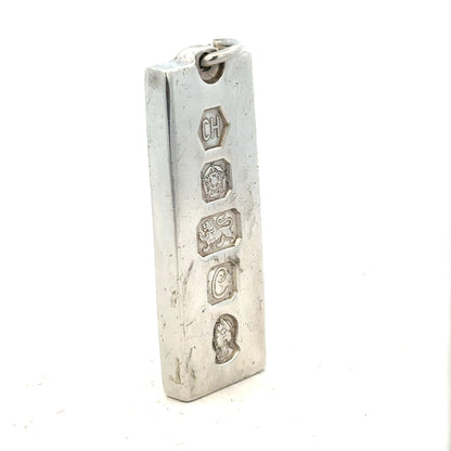 Silver ingot pendant weighing 31g with a smooth, shiny surface, designed as a jewelry pendant on a plain background.