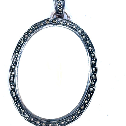 Silver pendant weighing 32.5g with a simple, elegant design, featuring a polished surface and a secure bail for chain attachment.