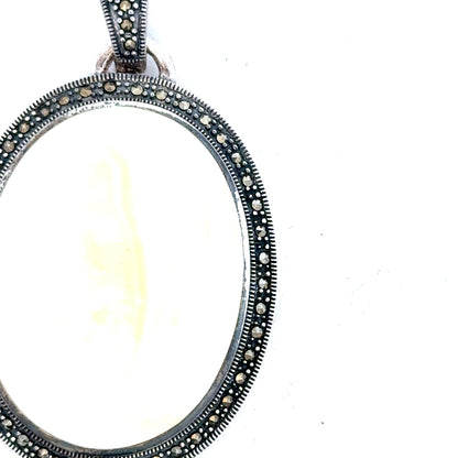Silver pendant weighing 32.5g, unbranded, with a sleek, polished design displayed on a plain background.