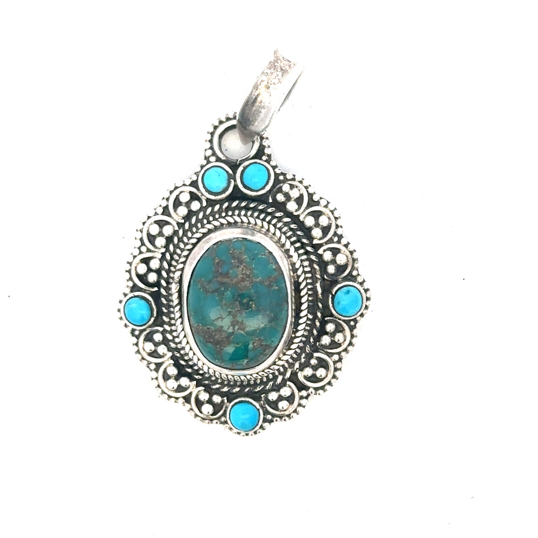 Silver pendants weighing 15.9g, unbranded, featuring intricate designs, shown in a close-up image.