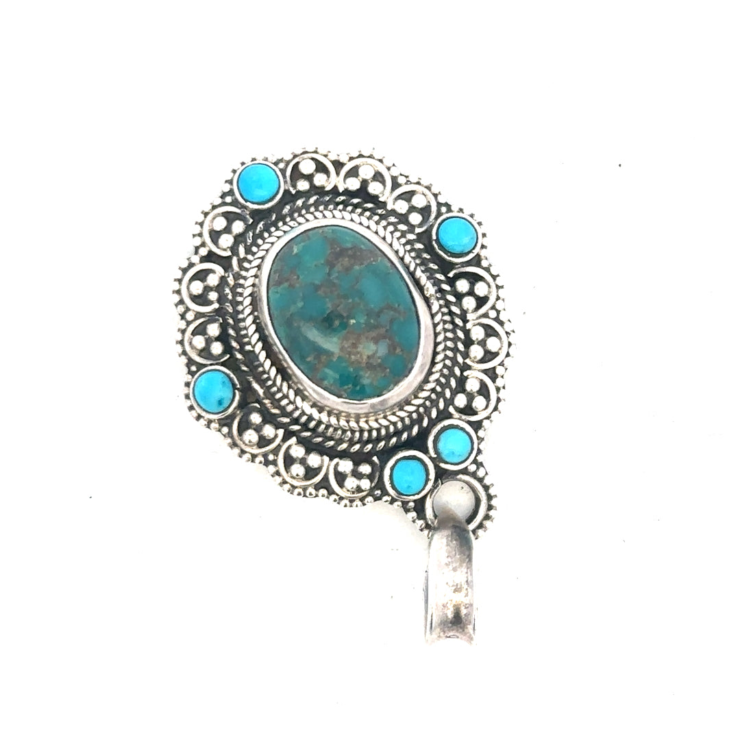 Silver pendant weighing 15.9g, displayed on a neutral background, showcasing its sleek, polished design and craftsmanship.