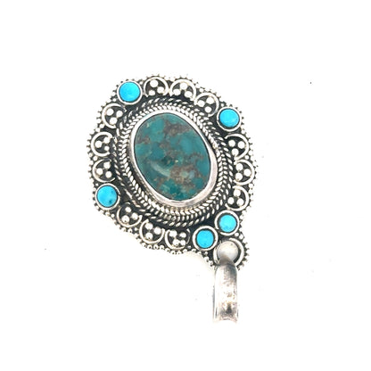Silver pendant weighing 15.9g, displayed on a neutral background, showcasing its sleek, polished design and craftsmanship.