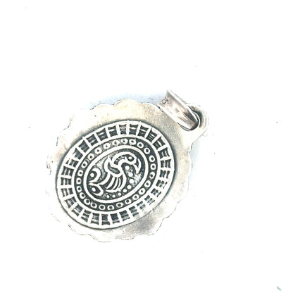 Silver pendant weighing 15.9g, featuring a sleek, polished design, suitable for necklaces and jewelry making.