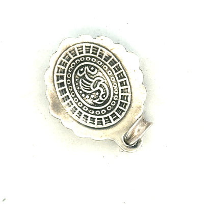 Silver pendant weighing 15.9g, unbranded, with a sleek, polished surface and intricate design details visible in the image.
