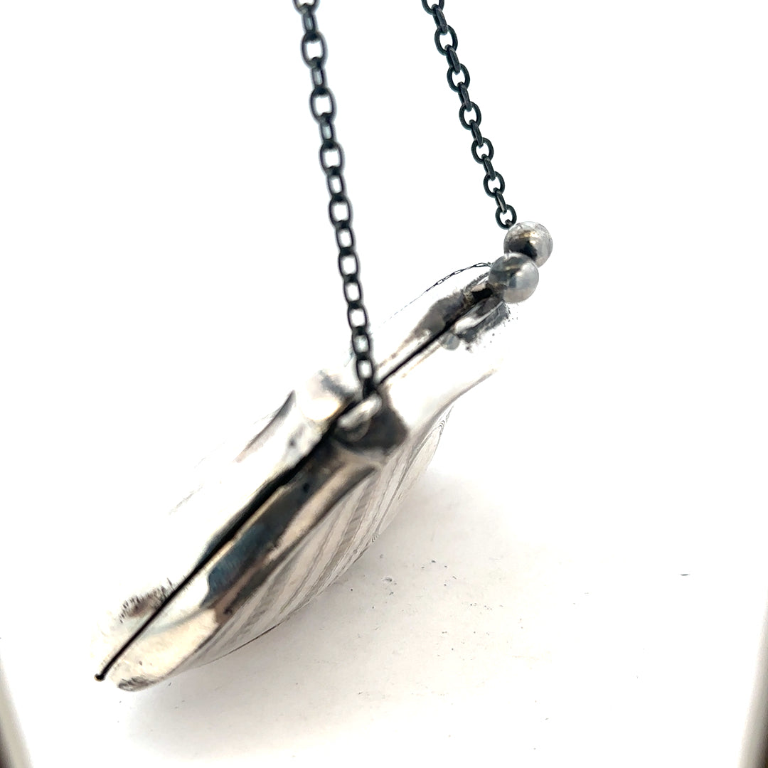 Silver purse weighing 66.2g with a sleek design, featuring a compact, stylish accessory for everyday use.