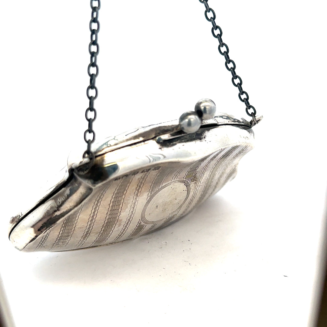 Silver purse weighing 66.2g with a sleek design, featuring a compact shape and metallic finish for stylish carrying.