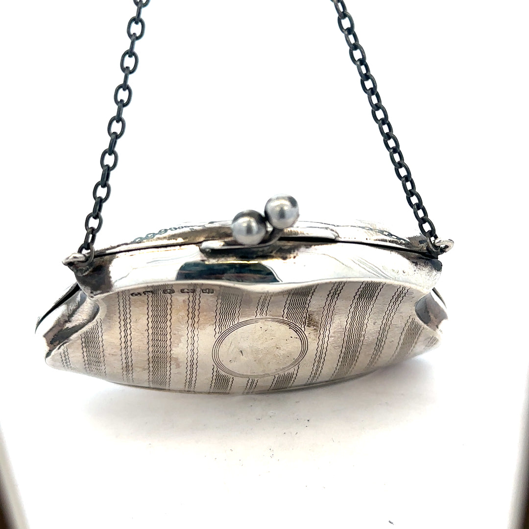 Silver purse weighing 66.2g with a sleek, compact design, made of shiny metallic material, perfect for stylish accessories.