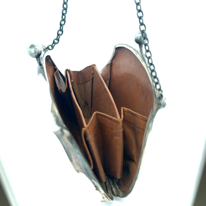 Silver purse weighing 66.2g with a sleek design, featuring a compact and stylish accessory for everyday use.
