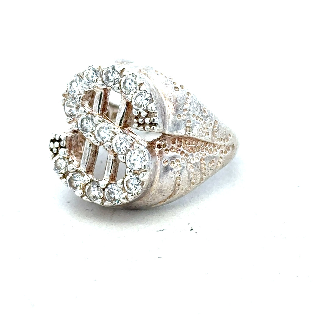 Silver ring in size R with a smooth band, unbranded jewelry piece displayed on a plain background.