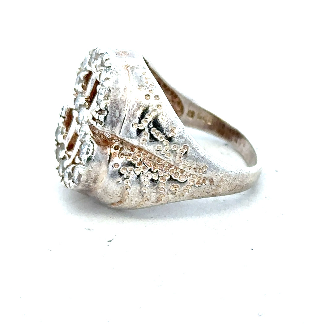 Silver ring in size R with a simple band design, displayed on a white background.