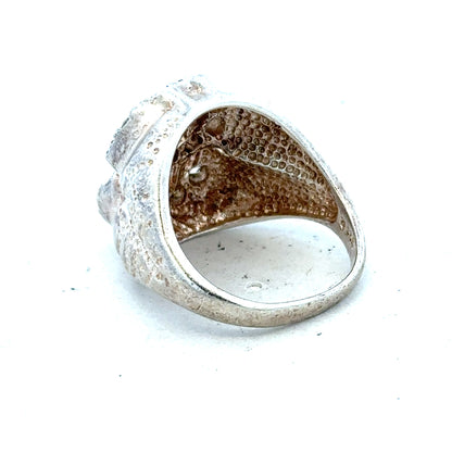 Silver ring size R with a smooth band, unbranded jewelry piece, displayed on a neutral background.
