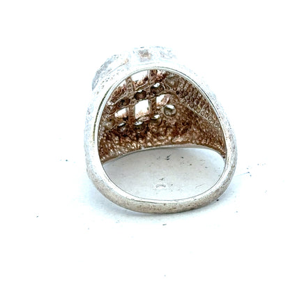 Silver ring in size R with a simple band design, displayed on a plain background.