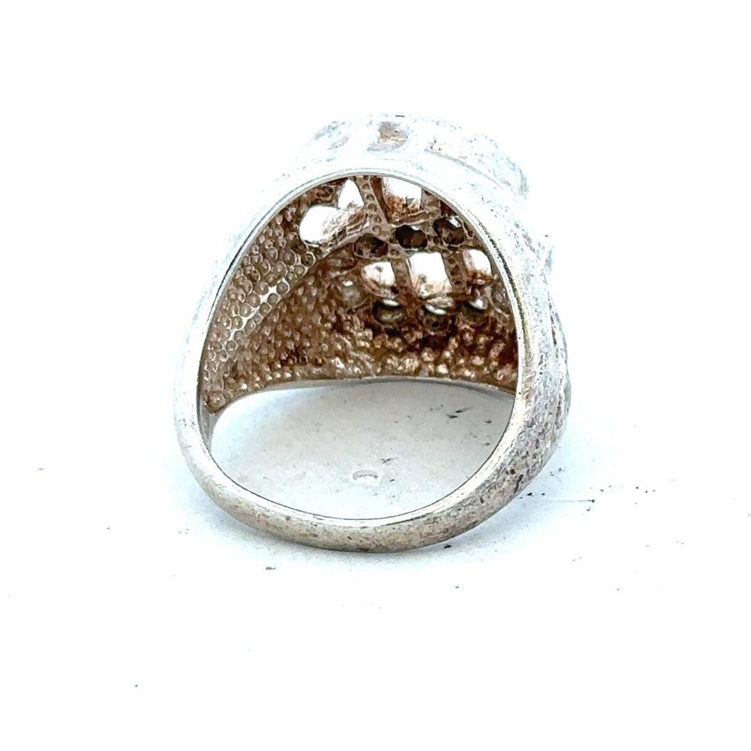 Silver ring in size R with a simple band design, unbranded jewelry, shown on a plain background.