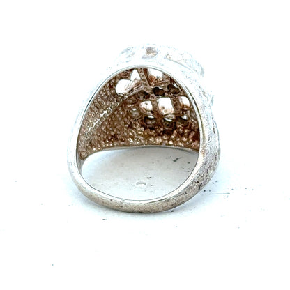 Silver ring in size R with a simple band design, unbranded jewelry, shown on a plain background.