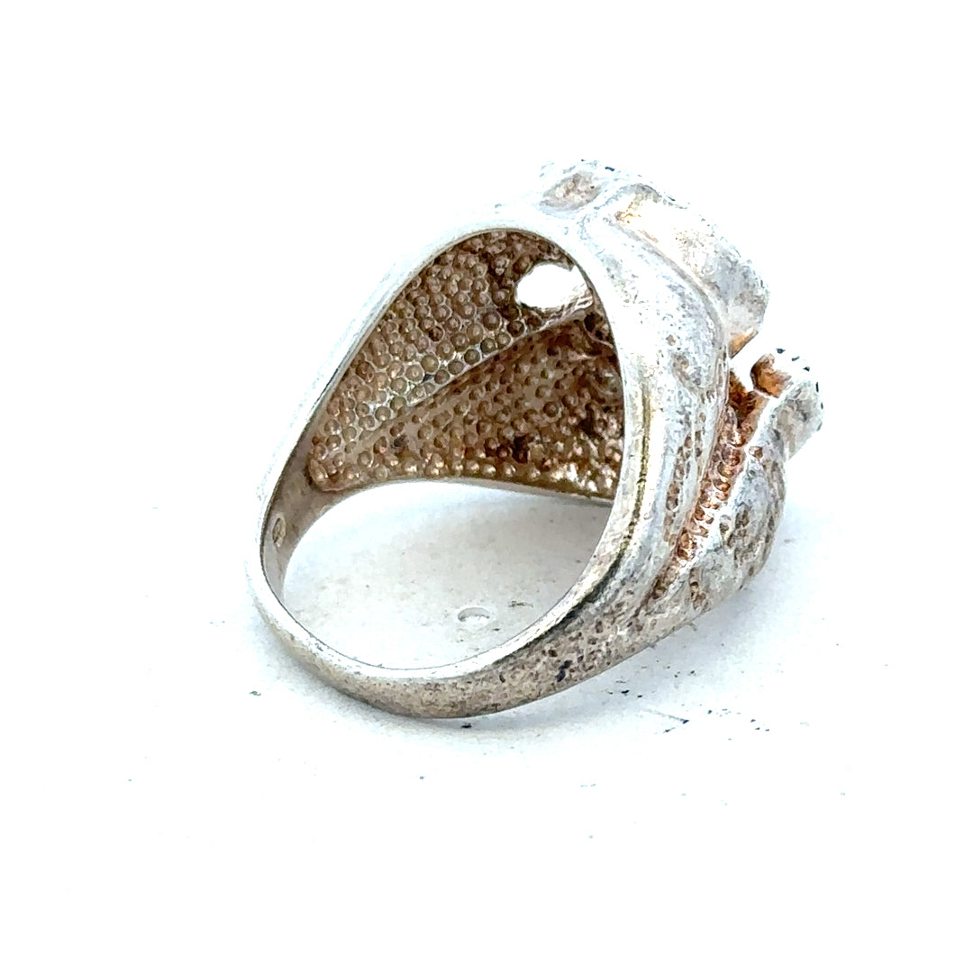 Silver ring in size R with a smooth band, displayed on a neutral background, showcasing its simple, elegant design.