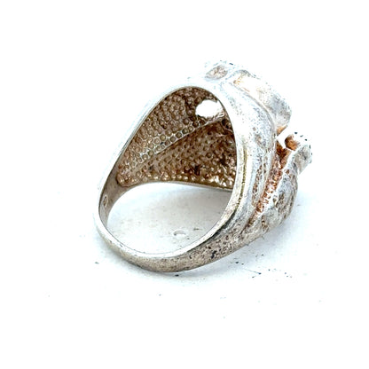 Silver ring in size R with a smooth band, displayed on a neutral background, showcasing its simple, elegant design.