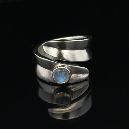 Silver ring size R with a smooth band, unbranded jewelry piece, displayed against a neutral background.