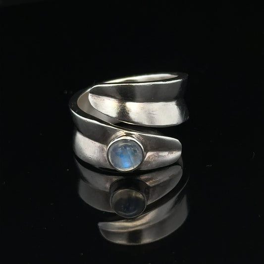 Silver ring size R with a smooth band, unbranded jewelry piece, displayed against a neutral background.