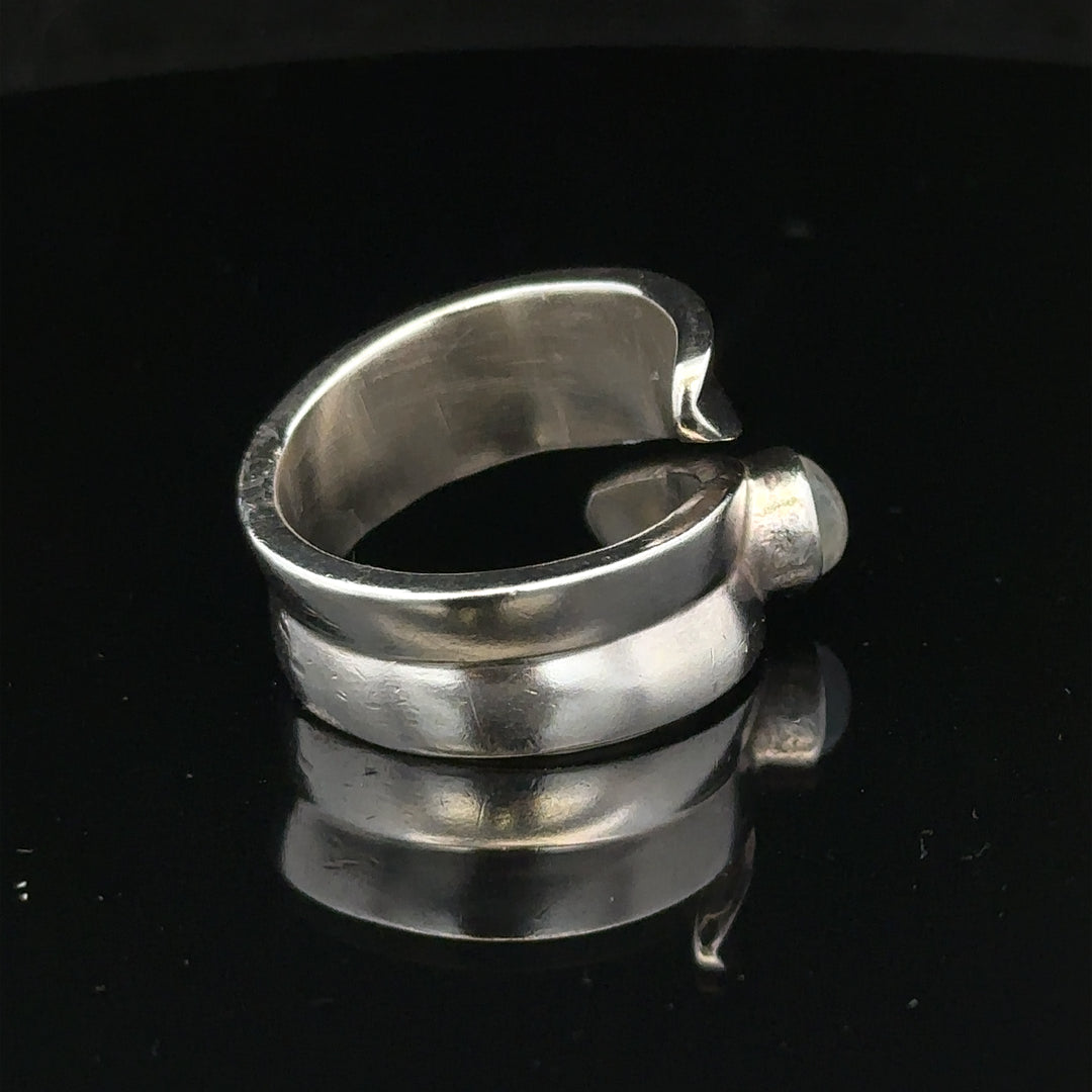 Silver ring in size R with a sleek, polished design, showcasing its smooth band and classic style.