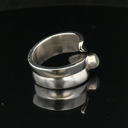 Silver ring in size R with a sleek, polished design, showcasing its smooth band and classic style.