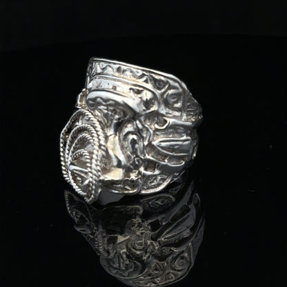 Silver saddle ring in size V with a smooth, polished design, crafted from unbranded silver metal.