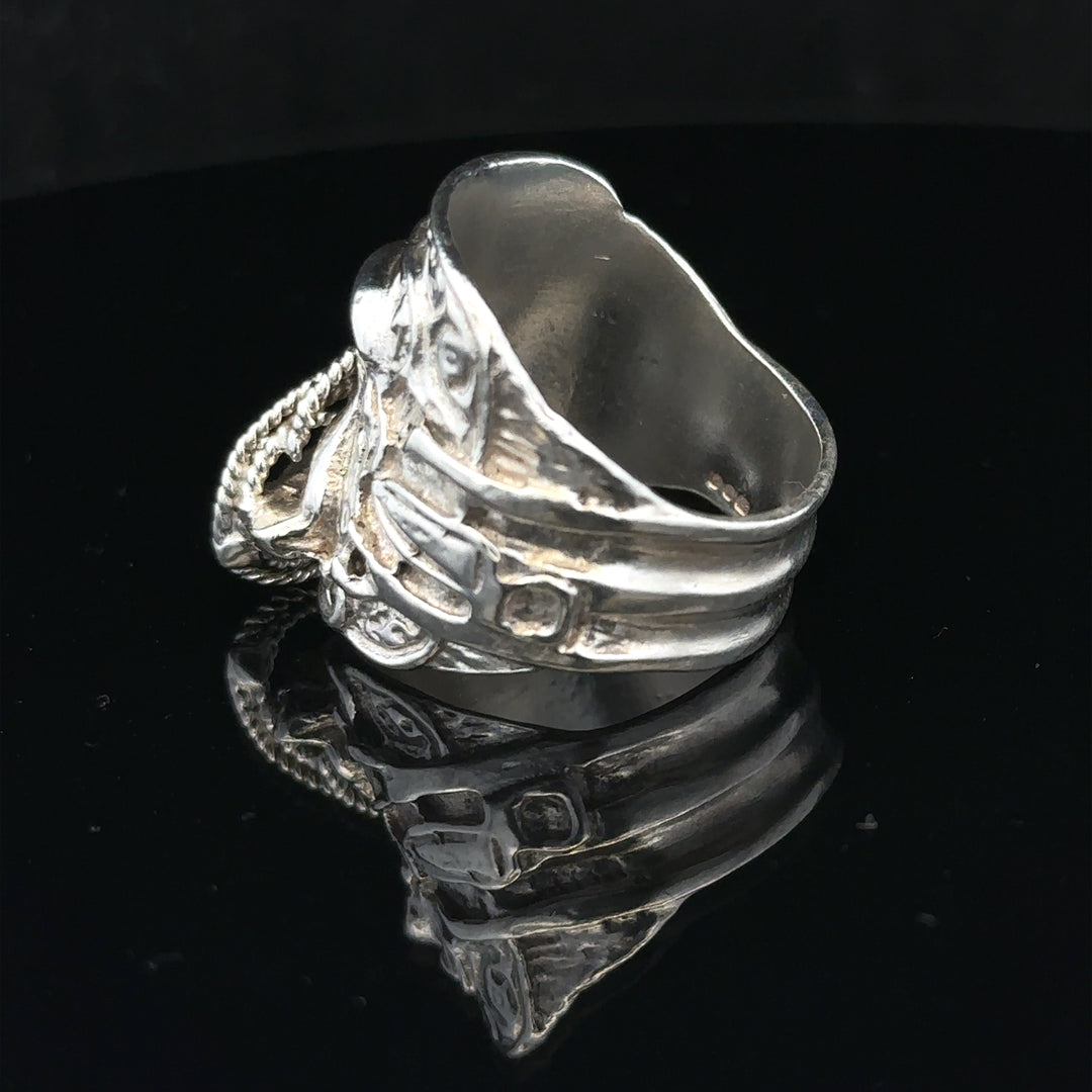 Silver saddle ring in size V, featuring a smooth, polished design, suitable for stylish everyday wear.