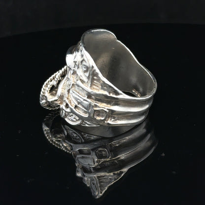 Silver saddle ring in size V, featuring a smooth, polished design, suitable for stylish everyday wear.