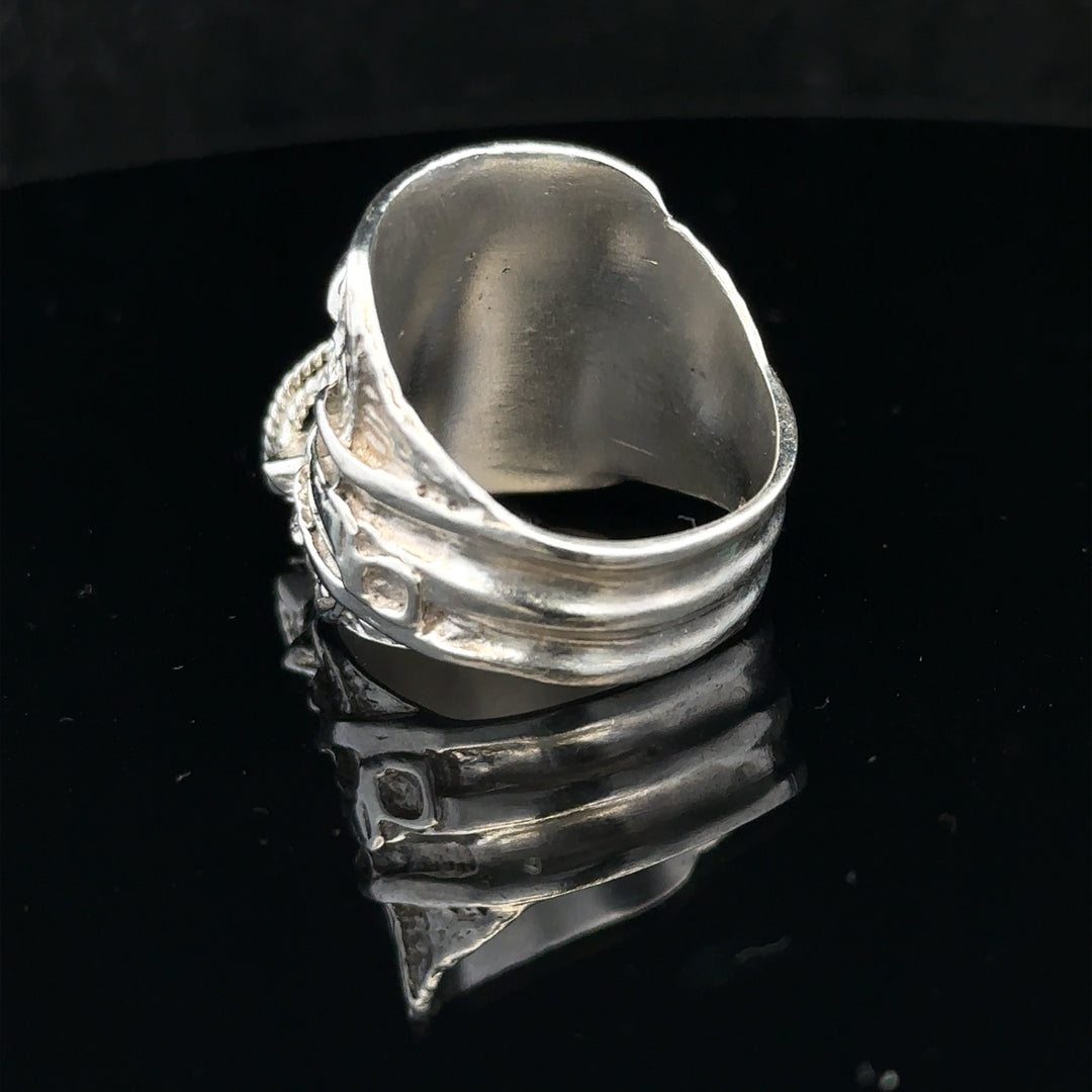 Silver saddle ring in size V featuring a smooth, polished design, perfect for stylish everyday wear.