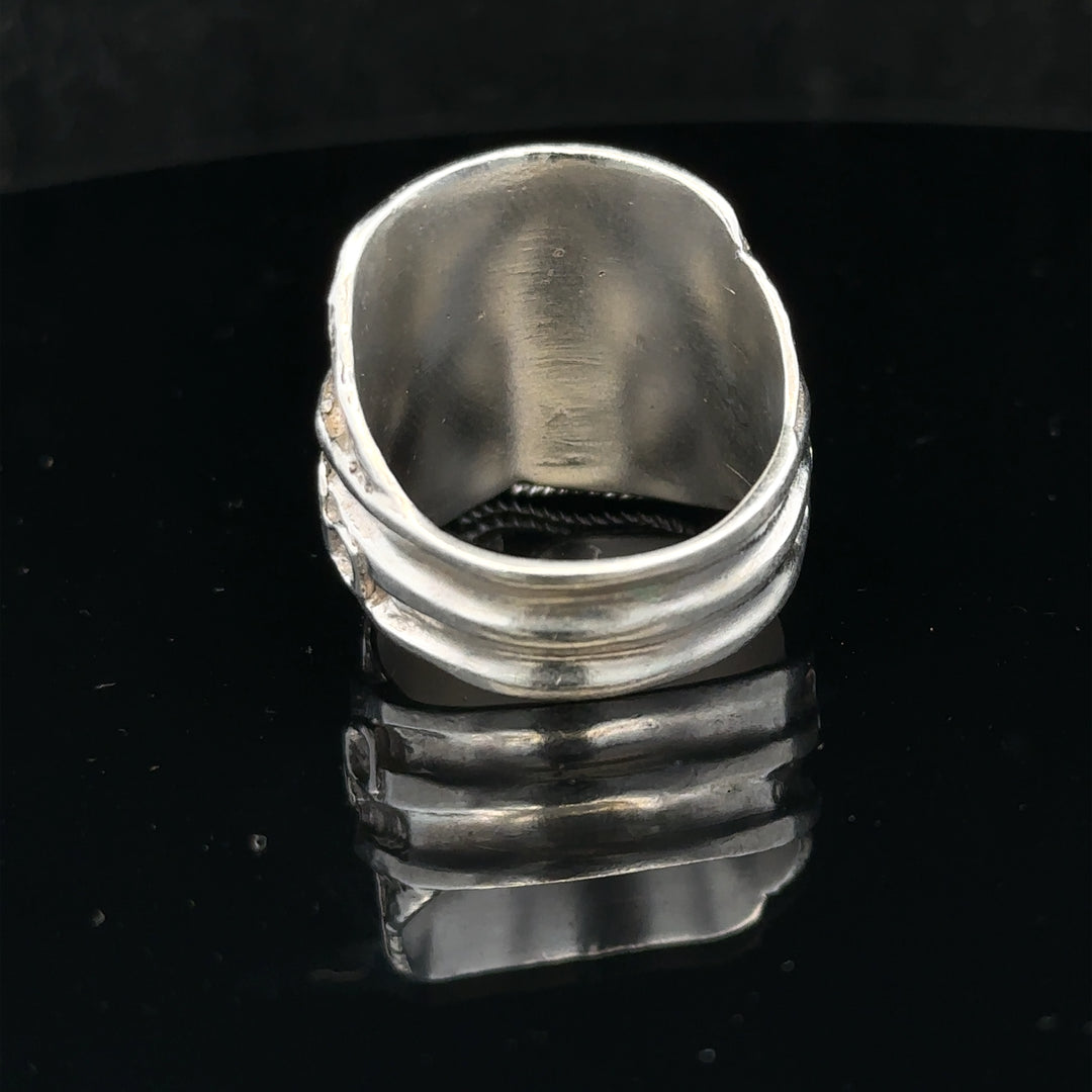 Silver saddle ring in size V, featuring a polished finish and classic design, perfect for stylish jewelry collection.