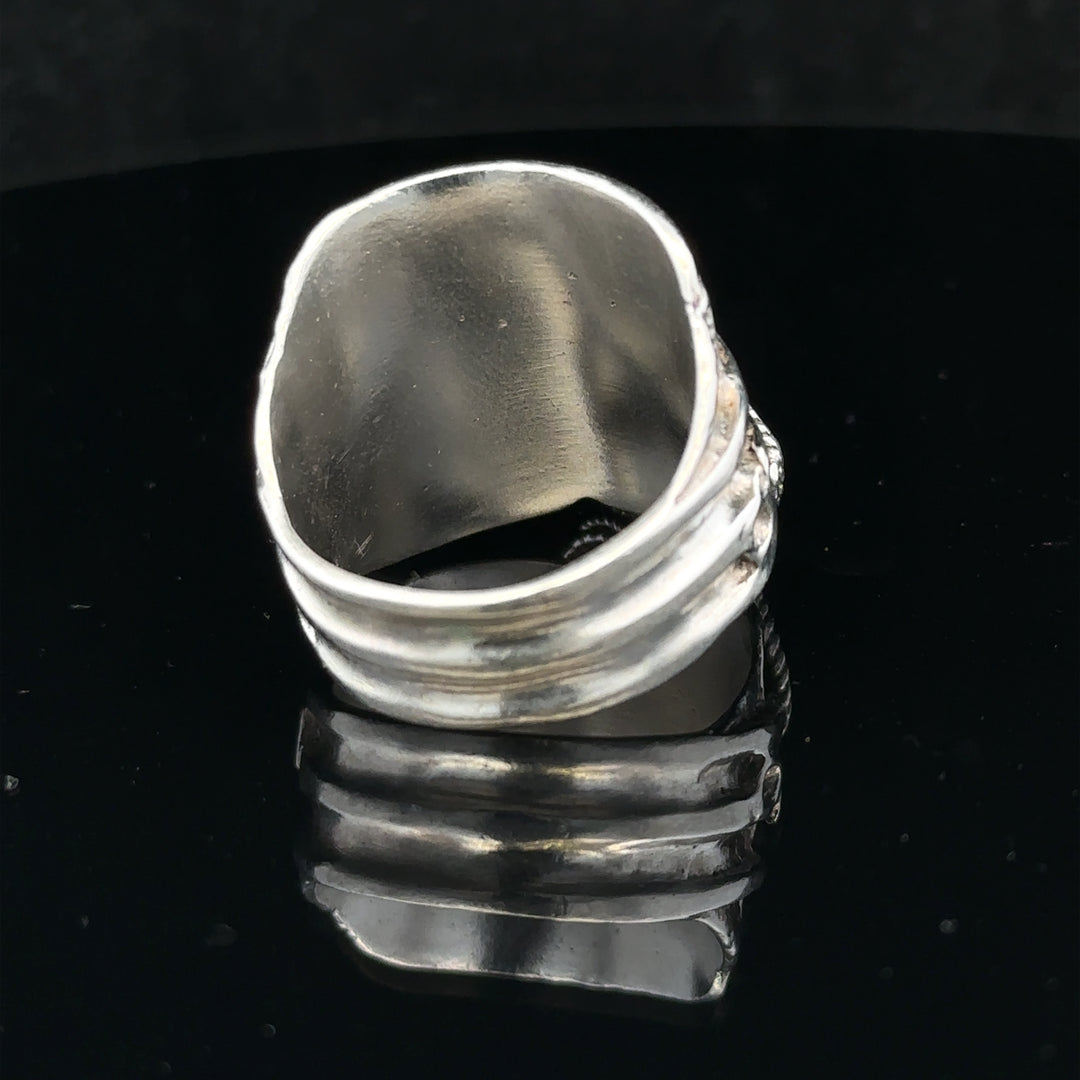 Silver saddle ring in size V with a smooth, polished finish, designed for stylish everyday wear.