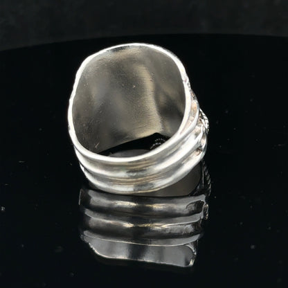 Silver saddle ring in size V with a smooth, polished finish, designed for stylish everyday wear.