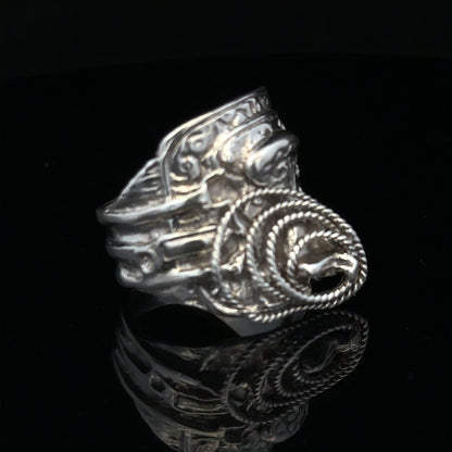 Silver saddle ring in size V, unbranded, featuring a smooth, polished design perfect for elegant jewelry collection.