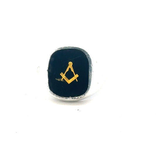 Silver signet ring in size O with engraved design, unbranded jewelry, close-up of the detailed metal band.