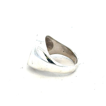 Silver signet ring in size O with a smooth finish, displayed on a plain background. Unbranded jewelry piece.