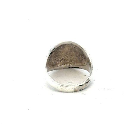 Silver signet ring in size O with a smooth polished surface, unbranded jewelry accessory.