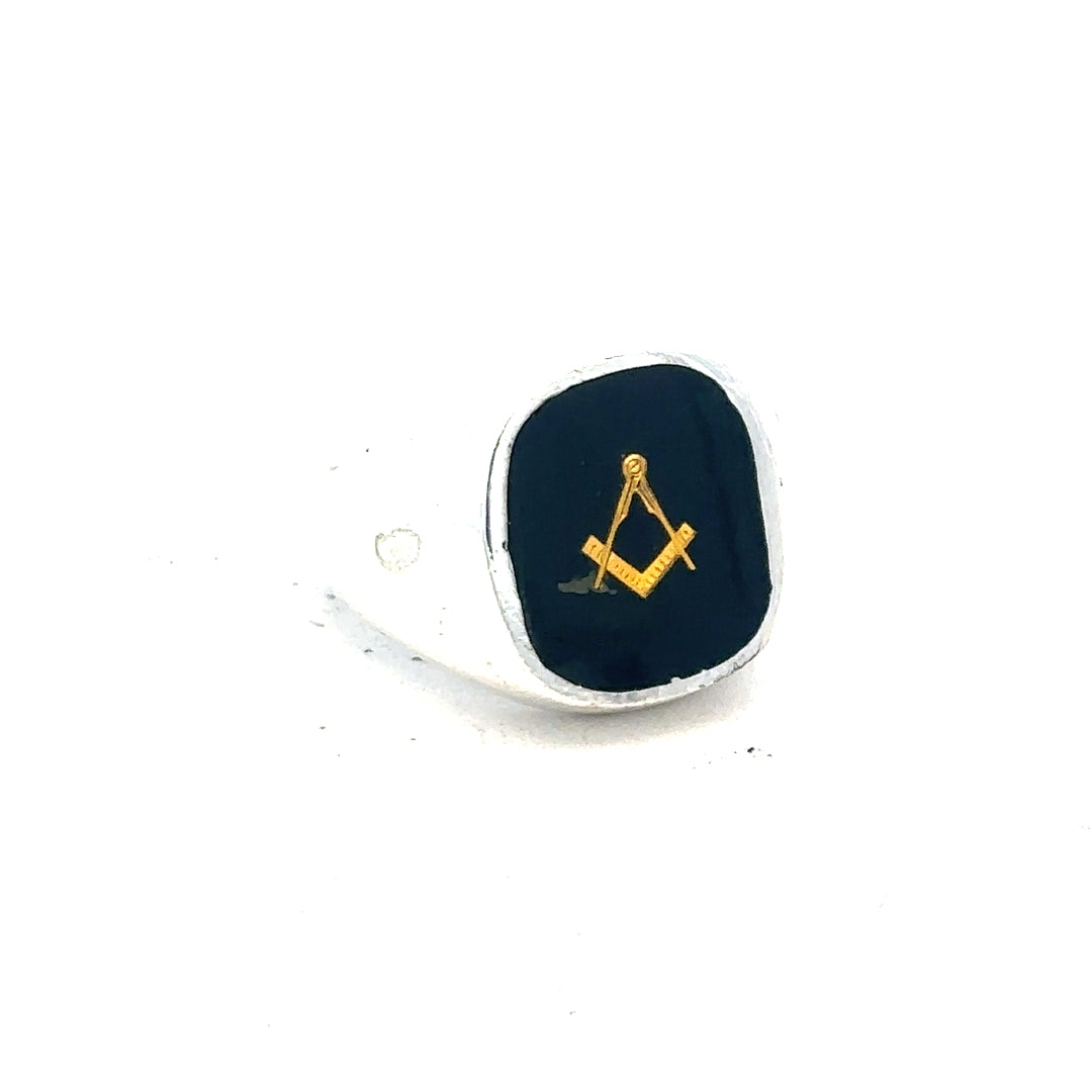 Silver signet ring in size O, unbranded, with smooth polished surface and classic design, displayed on a plain background.