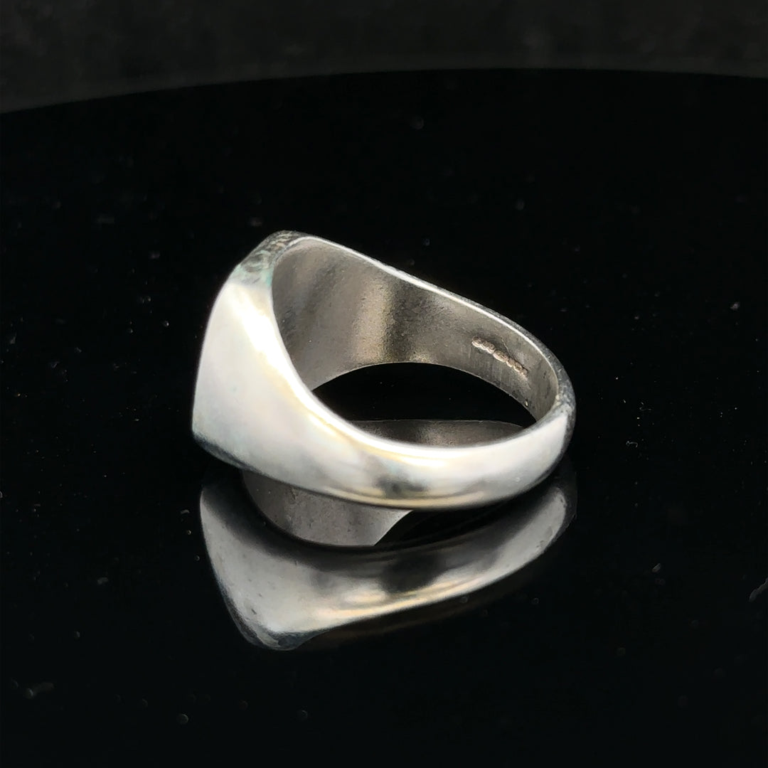 Silver signet ring in size V with a smooth, polished finish, crafted from unbranded silver metal.