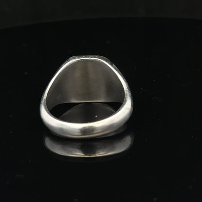 Silver signet ring in size V with a smooth polished finish, featuring a classic design and unbranded style.