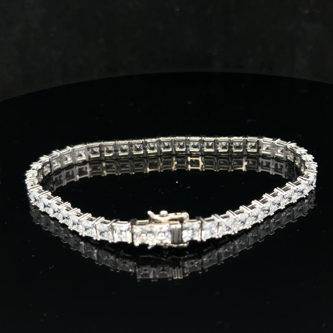 Silver tennis bracelet weighing 15.6g with a sleek chain design, shown in a close-up view highlighting its elegant craftsmanship.