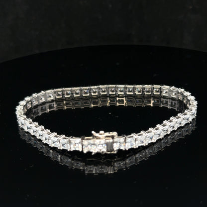 Silver tennis bracelet weighing 15.6g with a sleek chain design, shown in a close-up view highlighting its elegant craftsmanship.