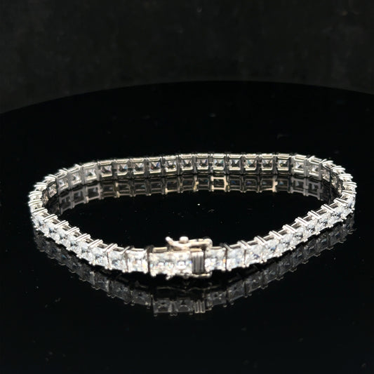 Silver tennis bracelet weighing 15.6g with a sleek chain design, shown in a close-up view highlighting its elegant craftsmanship.