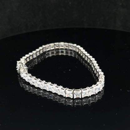 Silver tennis bracelet weighing 15.6g with linked chain design, featuring a sleek and elegant look.
