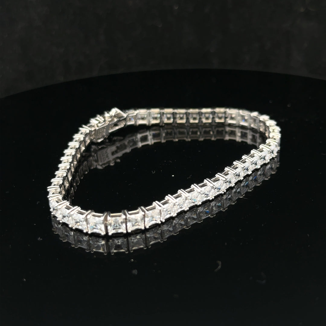 Silver tennis bracelet weighing 15.6g with a sleek, elegant design, featuring shiny silver links for a stylish look.