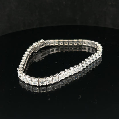 Silver tennis bracelet weighing 15.6g with a sleek, elegant design, featuring shiny silver links for a stylish look.