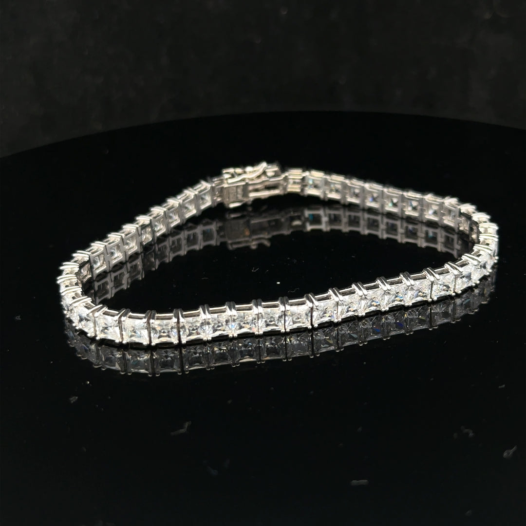Silver tennis bracelet weighing 15.6g with a sleek, elegant design, featuring shiny linked silver segments.