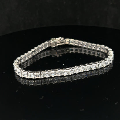 Silver tennis bracelet weighing 15.6g with a sleek, elegant design, featuring shiny linked silver segments.