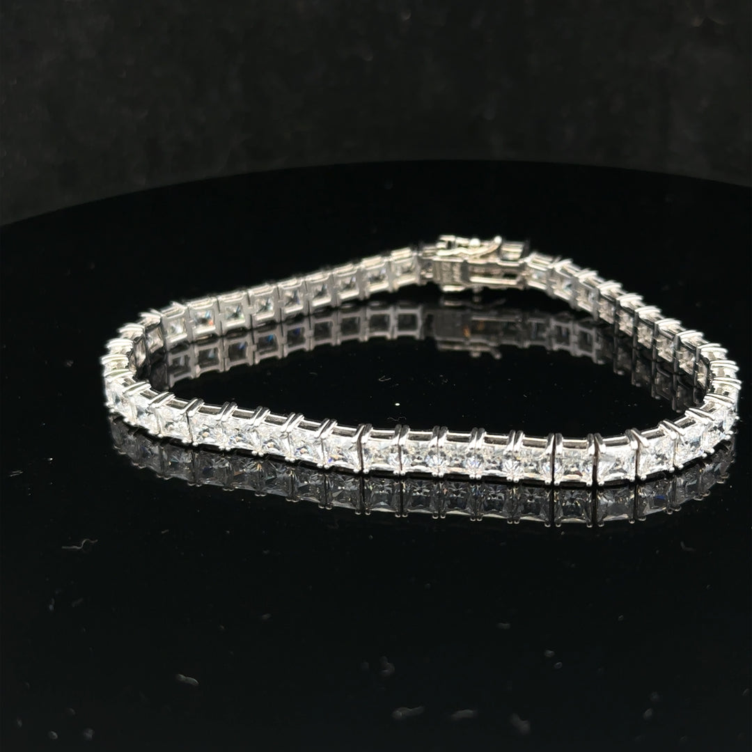 Silver tennis bracelet weighing 15.6g, featuring a sleek chain design, unbranded jewelry accessory with a polished finish.