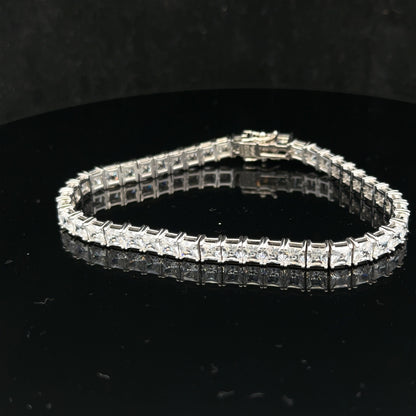 Silver tennis bracelet weighing 15.6g, featuring a sleek chain design, unbranded jewelry accessory with a polished finish.