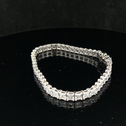 Silver tennis bracelet weighing 15.6g with a sleek, elegant design, featuring shiny silver links.